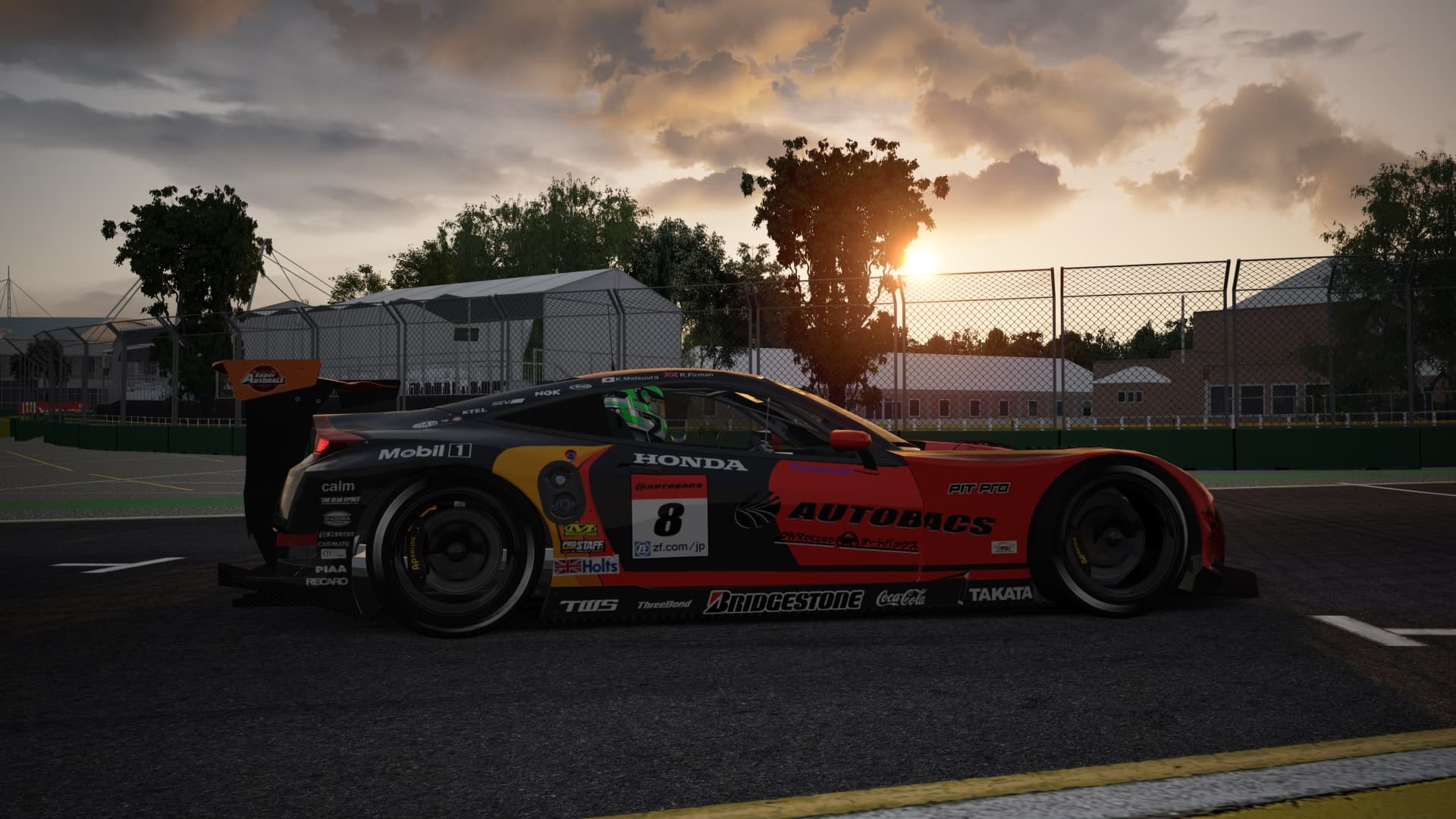 GT car at sunset on pit lane